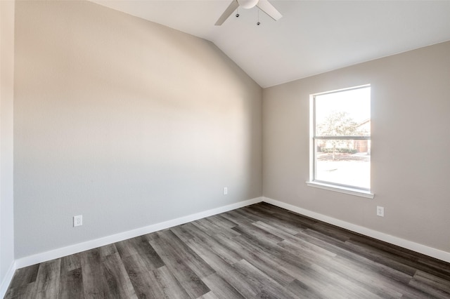 spare room featuring ceiling fan, lofted ceiling, and dark hardwood / wood-style floors