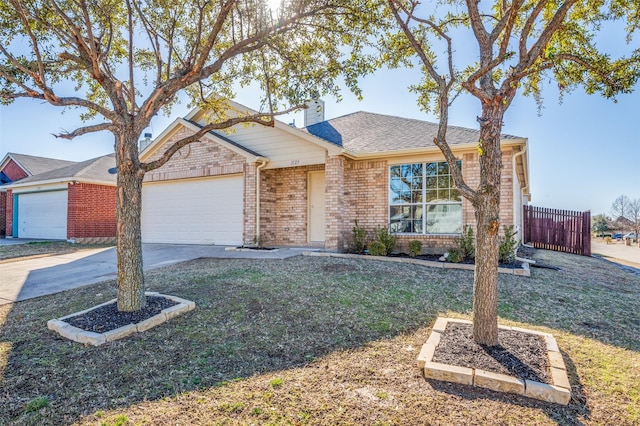 ranch-style home featuring a garage and a front yard