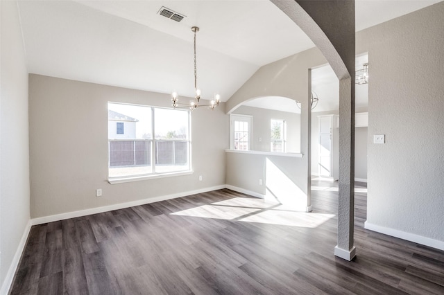 unfurnished dining area with lofted ceiling, a chandelier, and dark hardwood / wood-style flooring