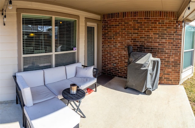 view of patio featuring an outdoor living space and a grill