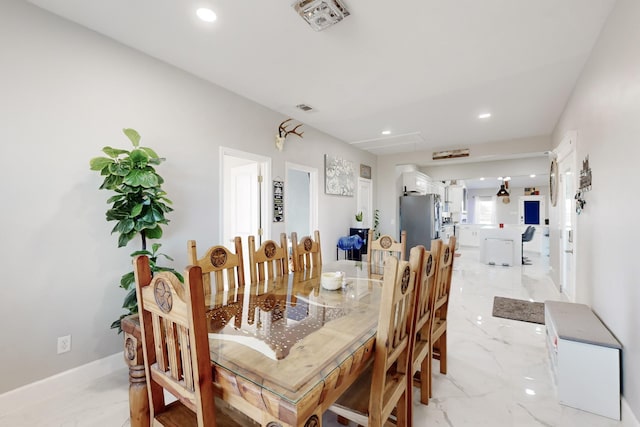 dining room featuring marble finish floor, visible vents, and recessed lighting