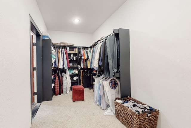 spacious closet with carpet flooring