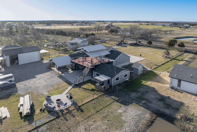 birds eye view of property featuring a rural view