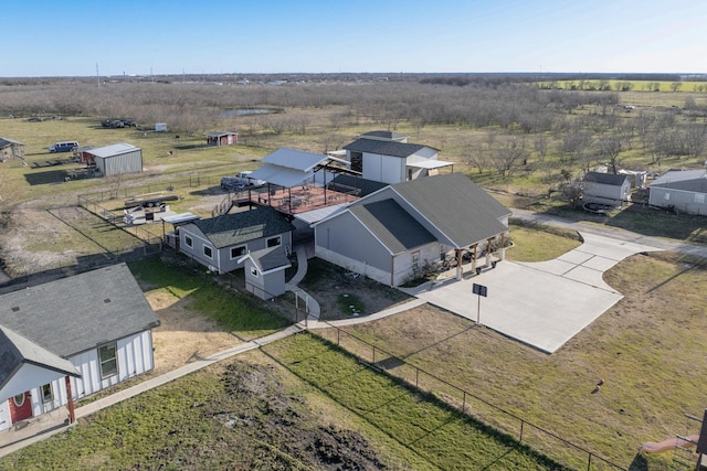 birds eye view of property with a rural view