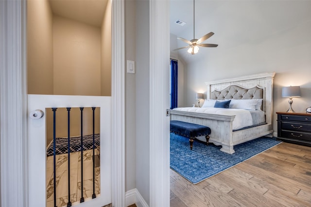 bedroom featuring hardwood / wood-style flooring and ceiling fan