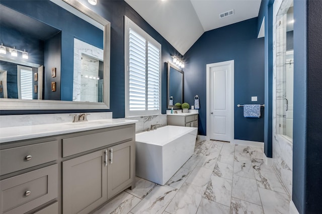 bathroom with vaulted ceiling, separate shower and tub, and vanity