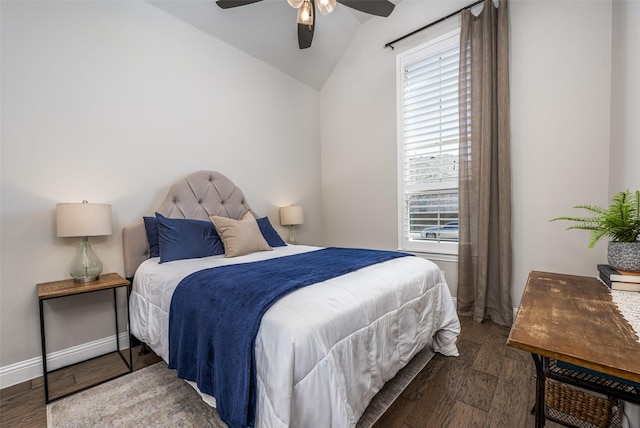 bedroom featuring wood-type flooring, vaulted ceiling, and ceiling fan