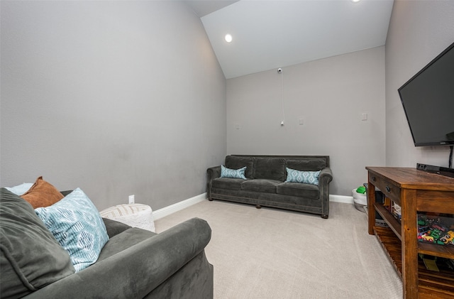 living room featuring lofted ceiling and carpet floors