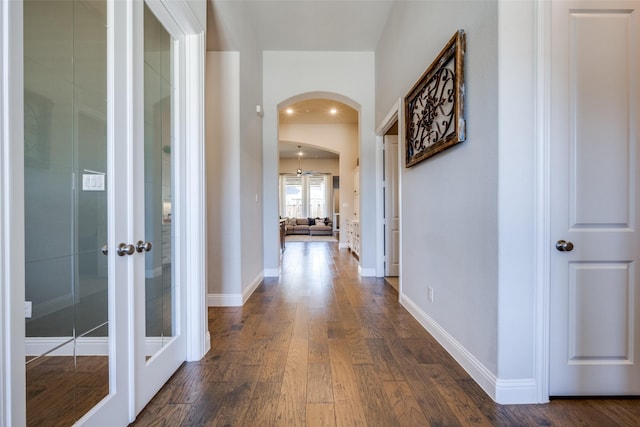 hall with dark hardwood / wood-style flooring and french doors