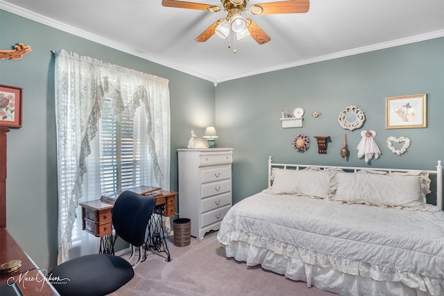 carpeted bedroom featuring crown molding and ceiling fan