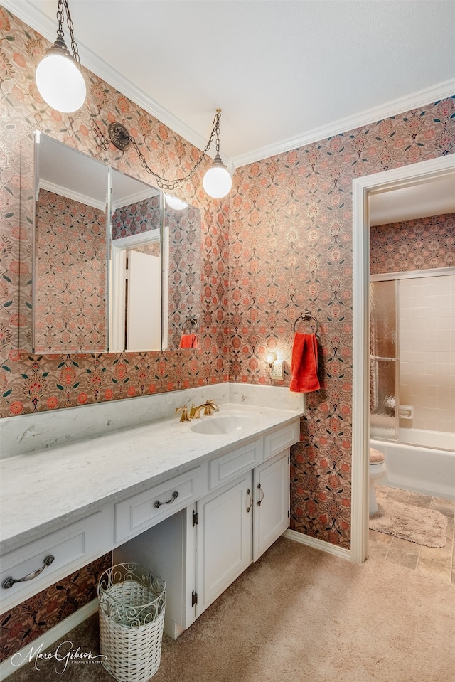 full bathroom with ornamental molding, vanity, washtub / shower combination, and toilet