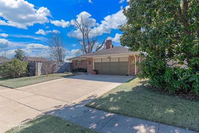 view of front of home with a garage and a front yard