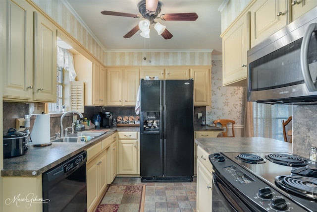 kitchen featuring crown molding, sink, a healthy amount of sunlight, and black appliances