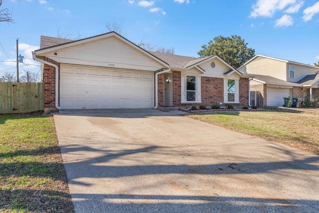 single story home featuring a garage and a front yard