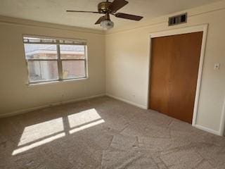 unfurnished bedroom featuring ceiling fan and carpet flooring