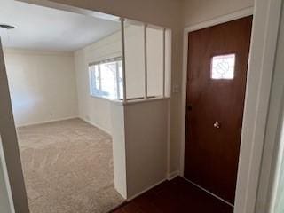 foyer featuring carpet