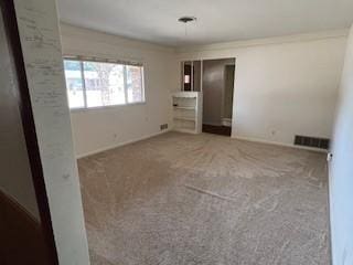 unfurnished bedroom featuring carpet floors