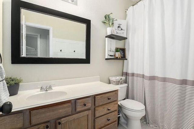 bathroom with vanity and toilet