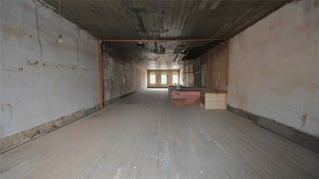 basement with wood-type flooring