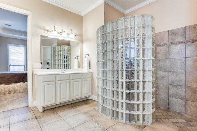 bathroom featuring crown molding, vanity, tile patterned flooring, and walk in shower