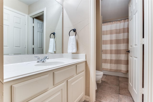 bathroom featuring vanity, toilet, and a shower with shower curtain