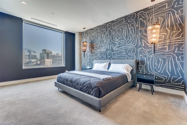 2408 Victory Park Ln Unit 1037, Dallas, TX 75219 - carpeted bedroom with baseboards and wallpapered walls