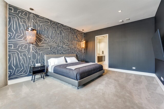 2408 Victory Park Ln Unit 1037, Dallas, TX 75219 - bedroom featuring baseboards, carpet flooring, an accent wall, wallpapered walls, and recessed lighting