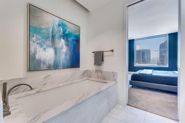 bathroom with tiled bath