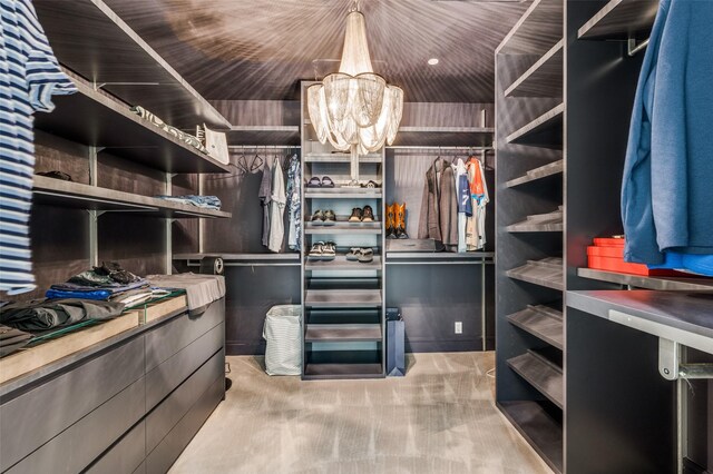 2408 Victory Park Ln Unit 1037, Dallas, TX 75219 - spacious closet with a chandelier and light carpet