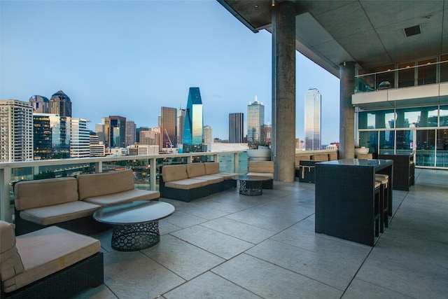 view of patio / terrace with a balcony and outdoor lounge area