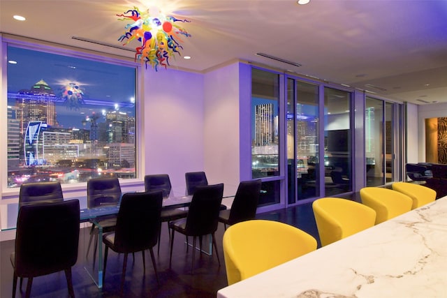 2408 Victory Park Ln Unit 1037, Dallas, TX 75219 - dining space featuring recessed lighting and a wall of windows