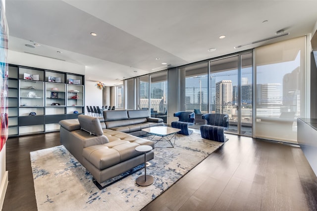 living room featuring hardwood / wood-style floors and a wall of windows