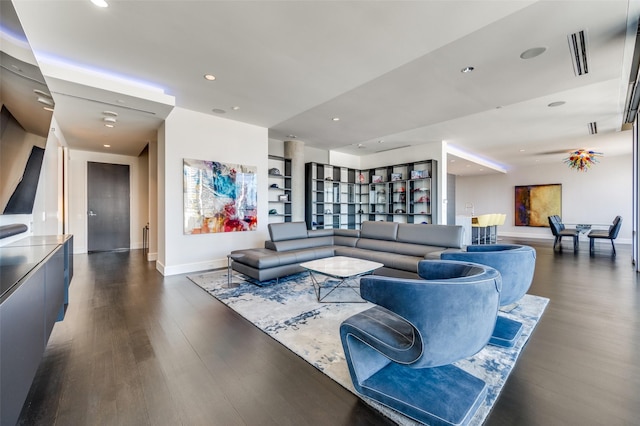 2408 Victory Park Ln Unit 1037, Dallas, TX 75219 - living area featuring wood finished floors, baseboards, and recessed lighting
