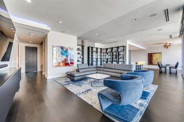 living room featuring dark wood-type flooring