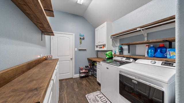 washroom with cabinets and washing machine and dryer