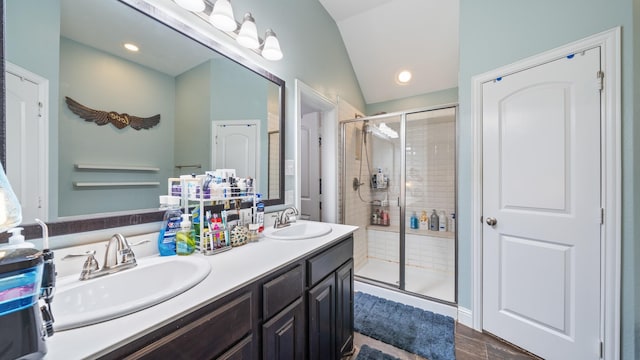 bathroom with vanity, an enclosed shower, vaulted ceiling, and hardwood / wood-style floors