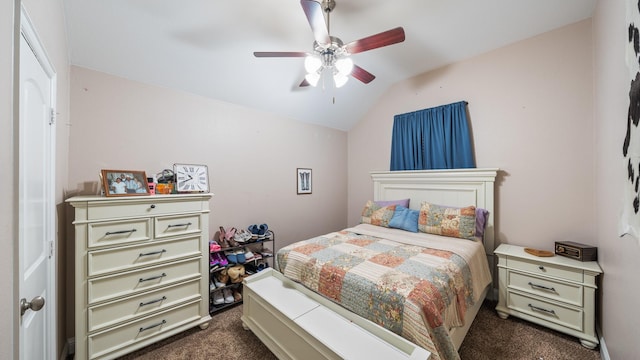 carpeted bedroom featuring lofted ceiling and ceiling fan