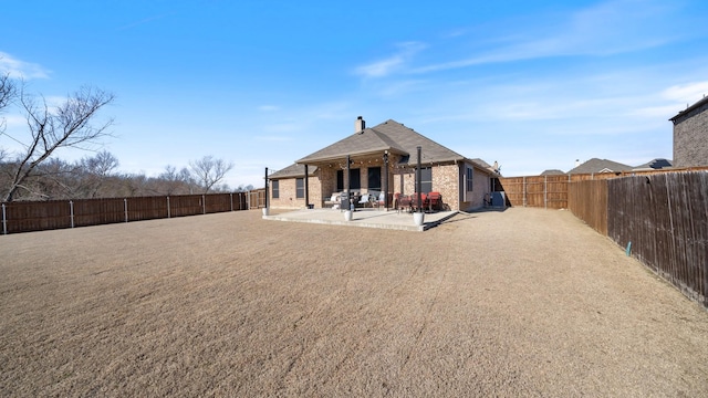 back of property featuring a patio