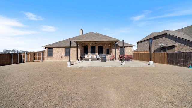 back of house featuring a patio area