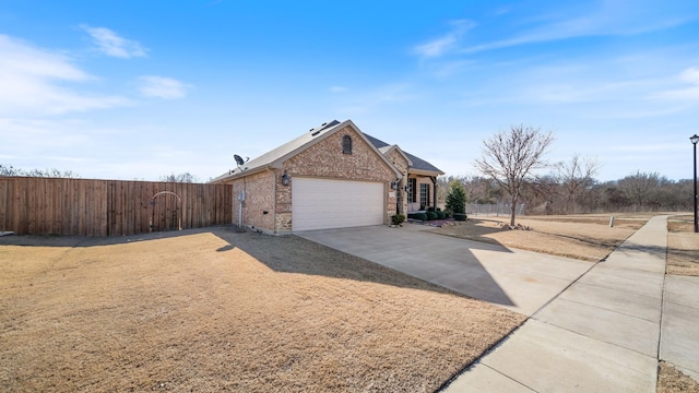 view of side of property with a garage