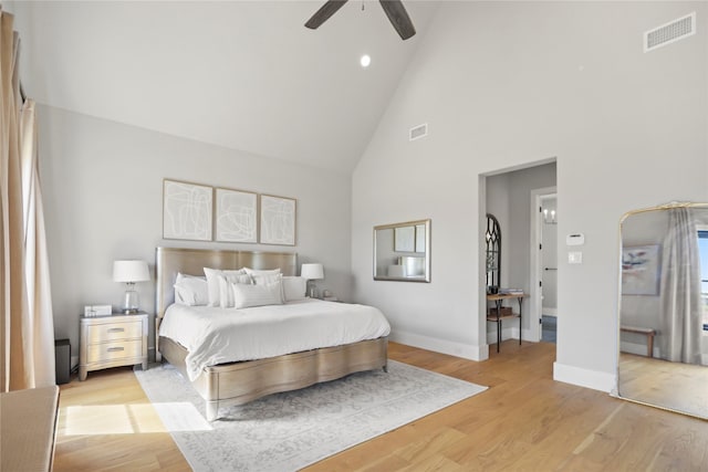 bedroom featuring high vaulted ceiling, ceiling fan, and light wood-type flooring