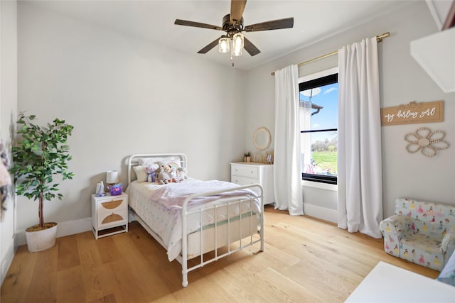 bedroom featuring ceiling fan and light hardwood / wood-style floors