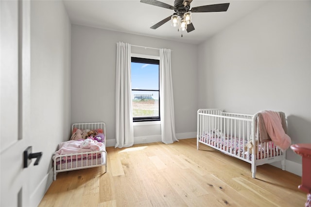 bedroom featuring wood-type flooring and ceiling fan