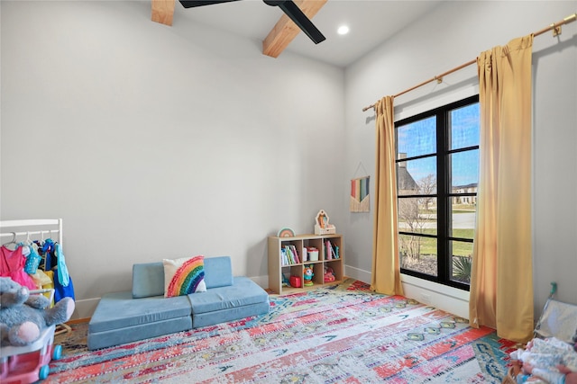 game room featuring beam ceiling