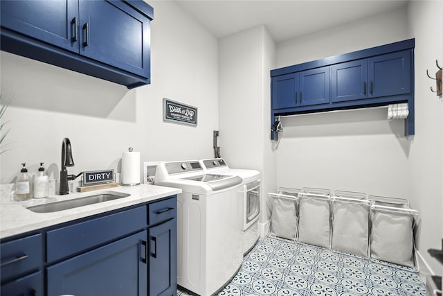 clothes washing area featuring cabinets, separate washer and dryer, sink, and light tile patterned floors