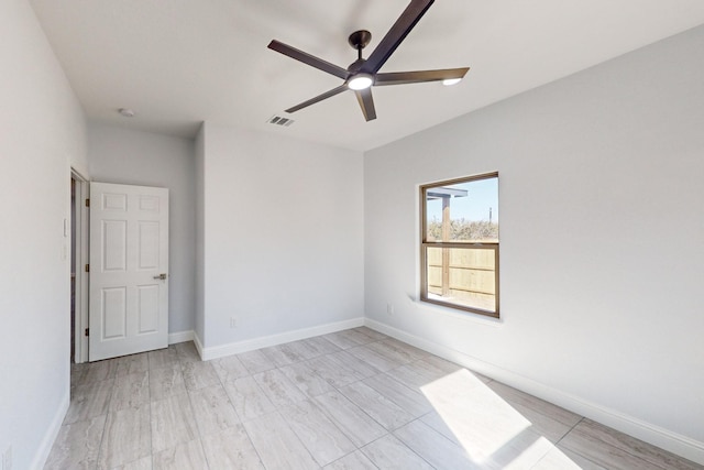 empty room with light hardwood / wood-style floors and ceiling fan