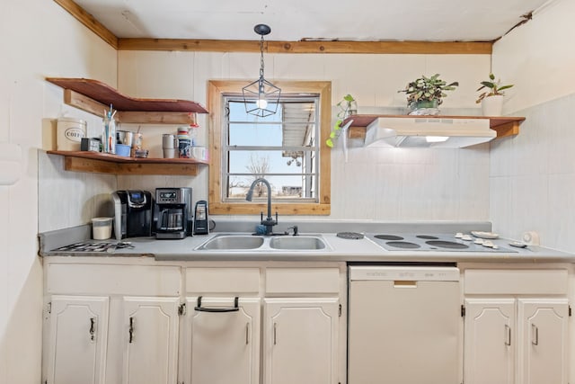 kitchen featuring hanging light fixtures, sink, white cabinets, and white appliances