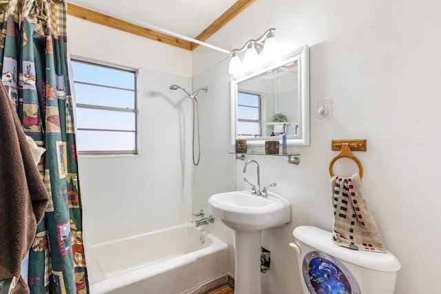 full bathroom with shower / bath combination with curtain, ornamental molding, toilet, and sink