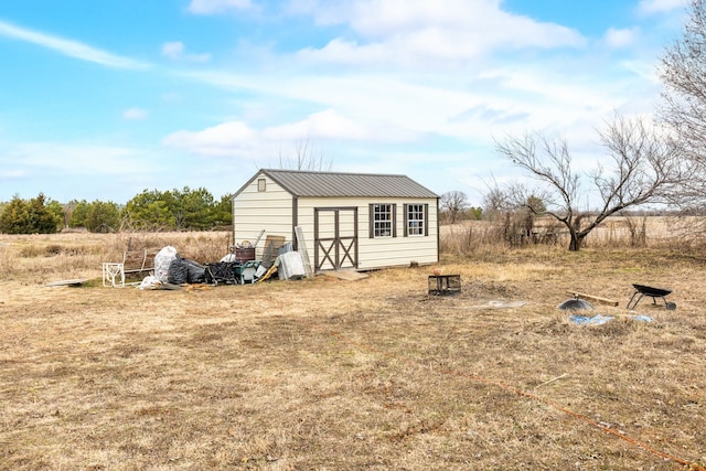 view of outbuilding with a rural view