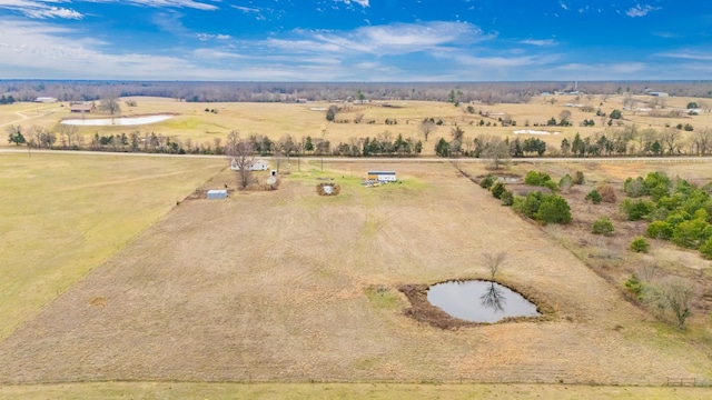 birds eye view of property with a rural view